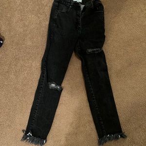 black ripped jeans with flares on the bottom size 27 worn multiple times